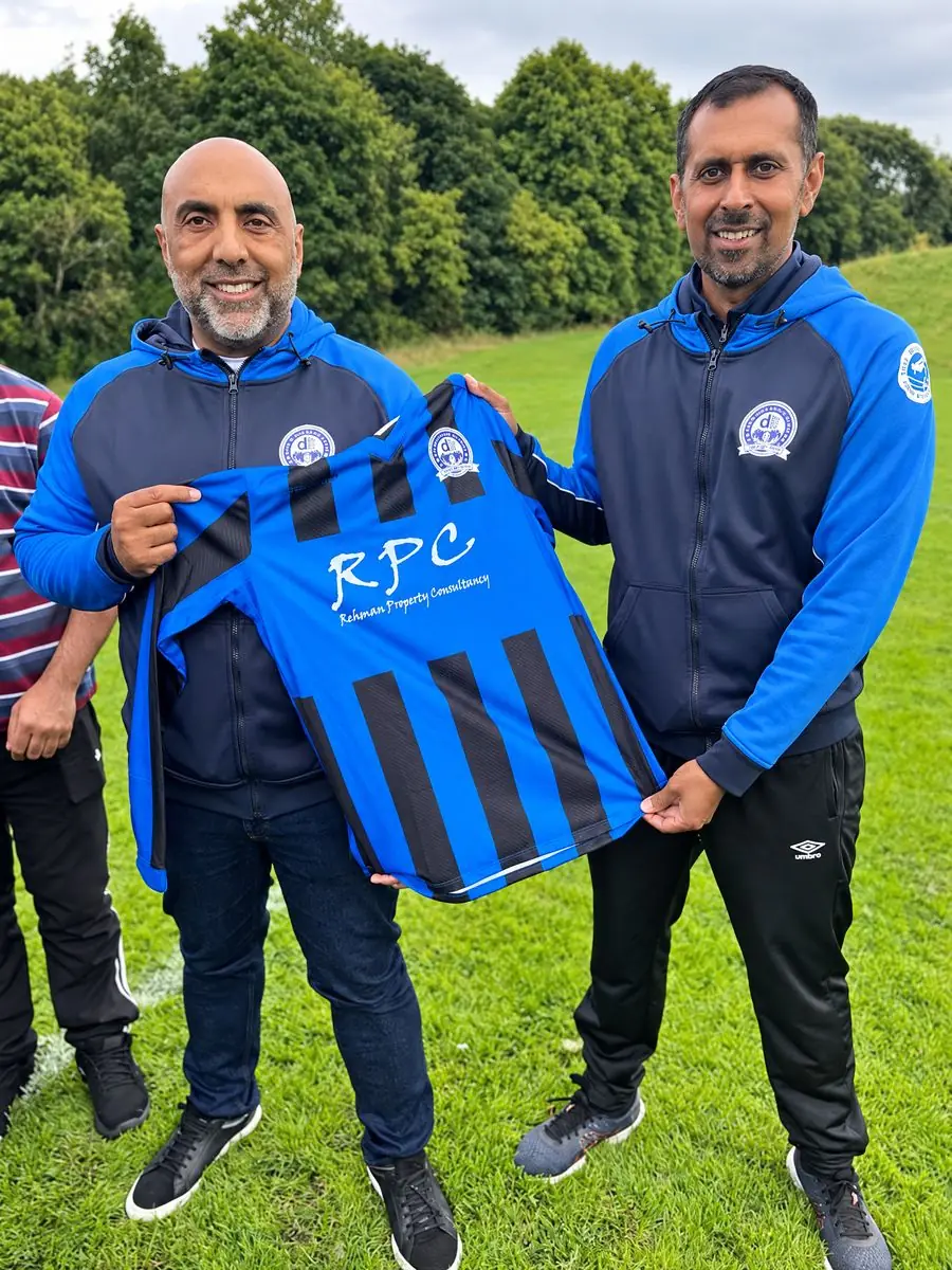 Daneshouse FC coaches holding an RPC sponsored shirt